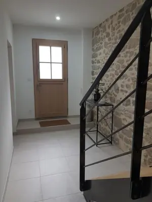 a staircase leading to the front door of a house at Maison Stellas in Fontiès-dʼAude