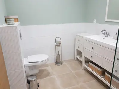 a bathroom with a toilet and a sink at Maison Stellas in Fontiès-dʼAude
