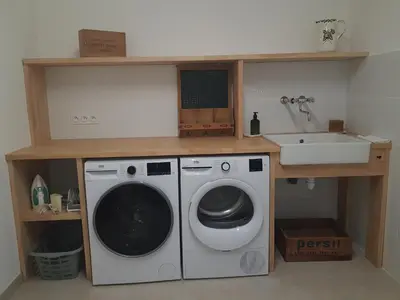 a laundry room with a washing machine and a sink at Maison Stellas in Fontiès-dʼAude