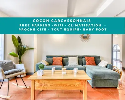 a living room with a couch and a coffee table at Cocon Carcassonnais - Free parking - Wifi - Climatisation - Tout équipée in Carcassonne