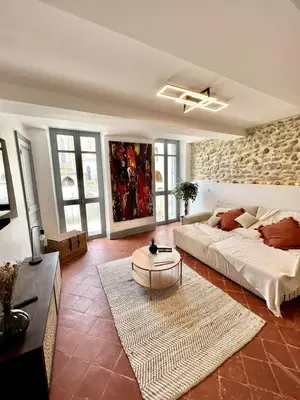 a living room with a couch and a table at The62 in Carcassonne