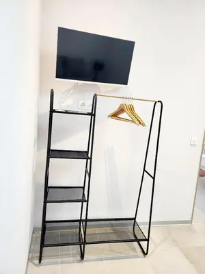 a glass shelf with a television on top of it at Maison au calme - Clim - Wi-Fi - terrasse et cours in Salles-d'Aude