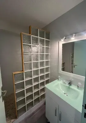 a bathroom with a sink and a mirror at Lo Nidou Gruissan in Gruissan