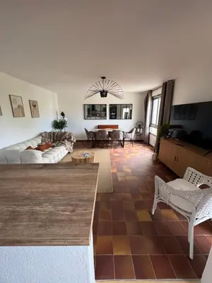 a living room with a couch and a table at La parenthèse in Pamiers