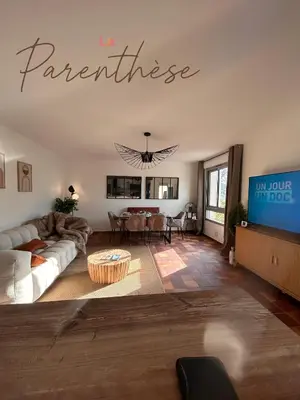 a living room with a couch and a table at La parenthèse in Pamiers