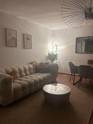 a living room with a couch and a coffee table at La parenthèse in Pamiers