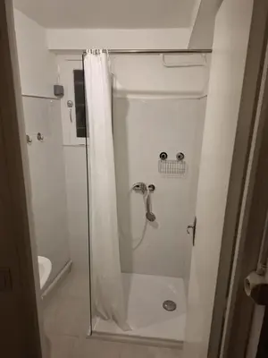 a bathroom with a shower with a shower curtain at Appartement Salles d 'Aude in Salles-d'Aude
