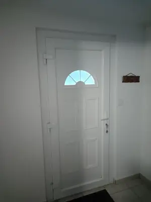 a white door with a window in a room at Appartement Salles d 'Aude in Salles-d'Aude