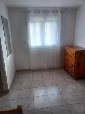 a room with a wooden dresser and a window at Appartement Salles d 'Aude in Salles-d'Aude