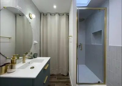 a bathroom with a shower and a sink and a mirror at Rêve Capestanais - B&B avec Piscine in Capestang