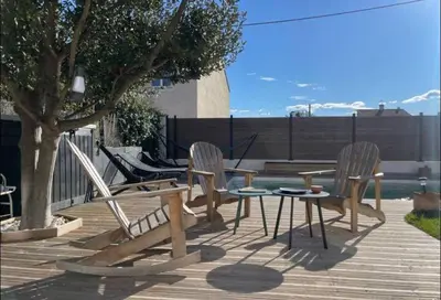 a patio with chairs and a table and a bench at Rêve Capestanais - B&B avec Piscine in Capestang