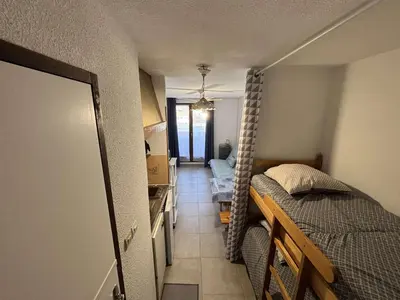 a small bedroom with a bed and a hallway at Appartement Studio-Cabine PORT-LA NOUVELLE PN290-074 in Port-la-Nouvelle