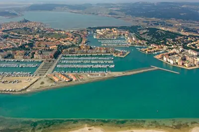 an aerial view of a harbor with a marina at Le Cordier - Apartment near the harbor in Gruissan
