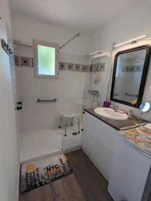 a bathroom with a tub and a sink and a shower at Escapade à Nailloux in Nailloux