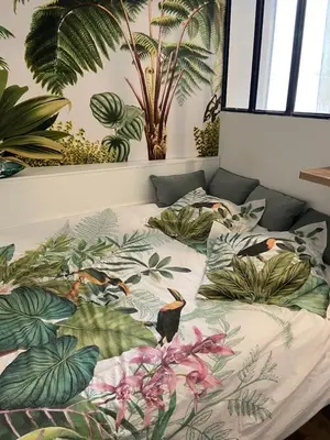 a bed with plants on it in a room at Studio design hypercentre Gare & espresso offert in Castelnaudary