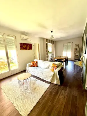 a living room with a couch and a table at Appartement Narbonne centre in Narbonne