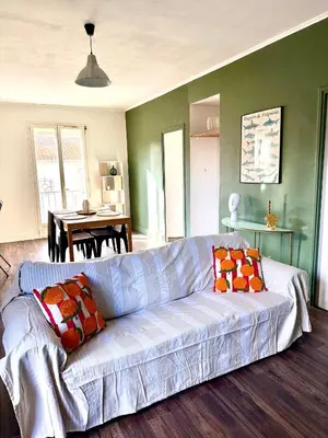 a living room with a couch and a table at Appartement Narbonne centre in Narbonne