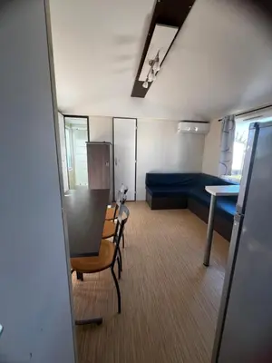 a small kitchen with a sink and a refrigerator at Mobil Home 014 climatisé -camping Novela-3Ch in Port-la-Nouvelle