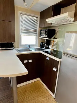 a microwave oven sitting on top of a kitchen counter at Mobil Home 014 climatisé -camping Novela-3Ch in Port-la-Nouvelle