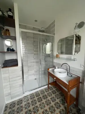 a bathroom with a shower and a sink at Les volets verts in Saint-Laurent-de-la-Cabrerisse