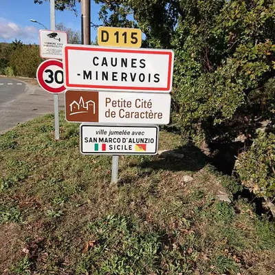 a group of signs on the side of a road at Avalon in Caunes-Minervois