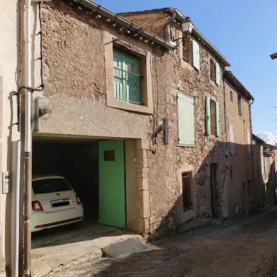 a car parked inside of a building with a garage at Avalon in Caunes-Minervois