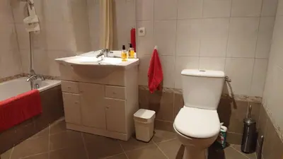 a bathroom with a white toilet and a sink at Avalon in Caunes-Minervois