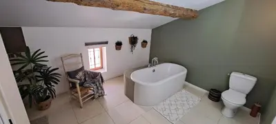 a bathroom with a toilet and a bidet at Le MAS CLEMENTINE in Puisserguier