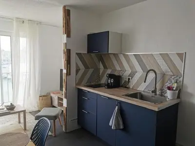 a kitchen with a sink and a counter top at Studio Cabine Vue Port Gruissan in Gruissan