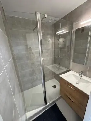 a bathroom with a shower and a sink at Studio Cabine Vue Port Gruissan in Gruissan