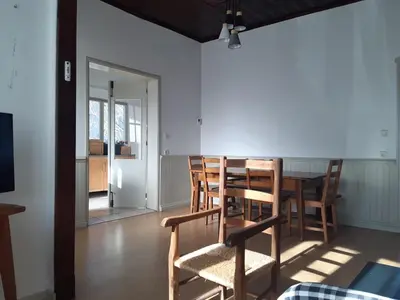 a dining room with a table and chairs at Maison 3 chambres - 25mn de Toulouse in Caraman
