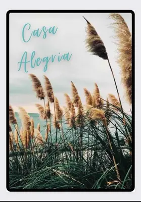 a picture of some tall grass in front of the ocean at Casa Alegria in Portel-des-Corbières