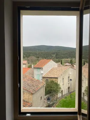 a view from a window of a town at Gîte lumineux avec jardin, vue sur Peyrepertuse in Rouffiac-des-Corbières