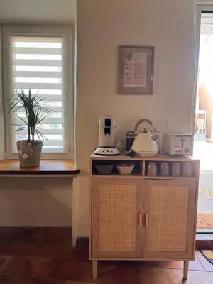 a kitchen with a counter with a sink and a appliance at La Bohème - Cosy, calme & confort in Saint-Papoul