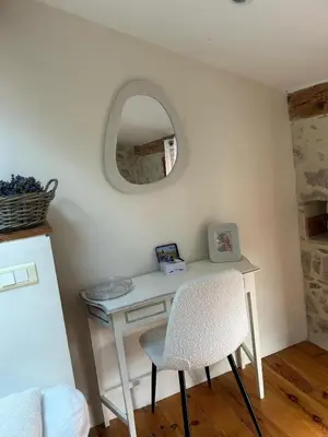 a white desk with a chair and a mirror at Maison de charme à Bélesta in Bélesta