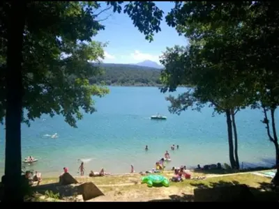 a group of people on a beach in the water at Maison de charme à Bélesta in Bélesta