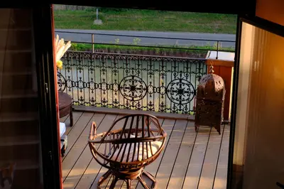 a balcony with a bench and a chair on a porch at Maison de charme et vue Imprenable à 180 degrés sur les vignes et Pyrénées in Paraza