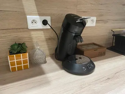 a model of a sewing machine sitting on a counter at Stylish Apartment with Balcony - Very Central - Long Stays and Pets Welcome in Carcassonne
