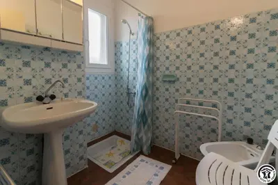 a bathroom with a sink and a toilet at En vayssieres