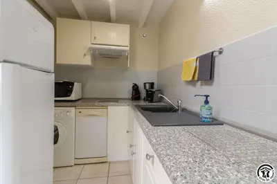 a kitchen with a sink and a dishwasher at Tournesols