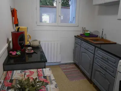 a kitchen with a sink and a counter top at Les platanes in Aignes