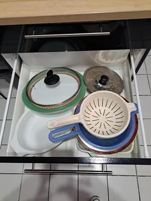 a kitchen utensils sitting on a shelf in a drawer at Plage du grazel le thalassa in Gruissan