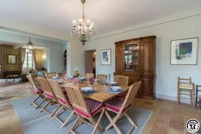 a dining room with a table and chairs at Chateau sud in Cessales