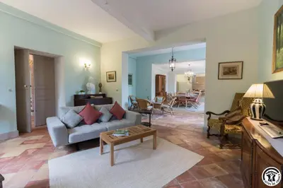 a living room with a couch and a table at Chateau sud in Cessales