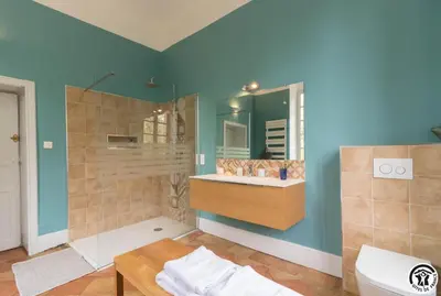 a bathroom with a shower and a sink and a mirror at Chateau sud in Cessales