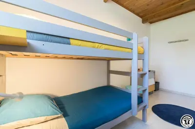 a bunk bed room with two bunk beds at La cajole in Montgaillard-Lauragais