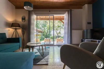 a living room with a couch and a table at La cajole in Montgaillard-Lauragais