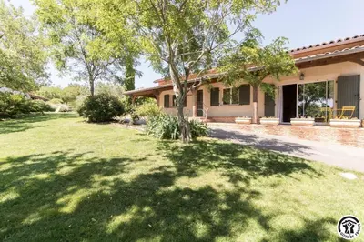 a house with a lawn in front of it at La cajole in Montgaillard-Lauragais