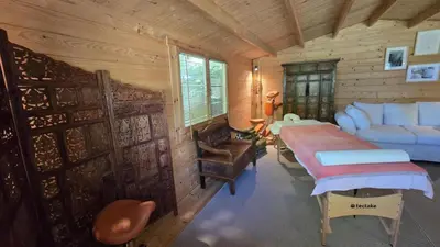 a bedroom with a bed and a couch in a room at Gîte Domaine de la Fée de l'Eau – L'Eau d'Ô in Saint-Félix-Lauragais