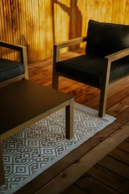 a living room with two chairs and a coffee table at Gîte Domaine de la Fée de l'Eau – L'Eau d'Ô in Saint-Félix-Lauragais